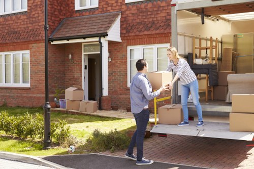 Unpacking boxes into a new Ruislip property with items sorted by room