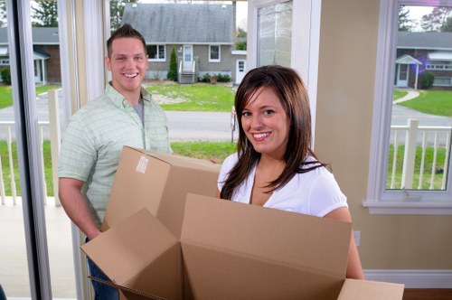 Student removals team helping with boxes and furniture in a Ruislip street