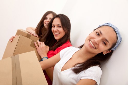 Packed moving boxes and furniture ready for transport in Ruislip