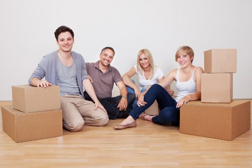 Local removals team helping with apartment moving and unloading