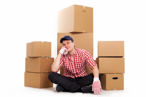 Professional movers carrying furniture through a residential property